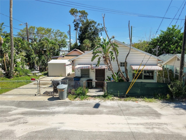 100 94th Ave, Treasure Island, FL 33706 - view of front of home featuring a gate