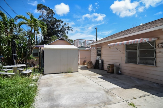 100 94th Ave, Treasure Island, FL 33706 - view of patio featuring a shed