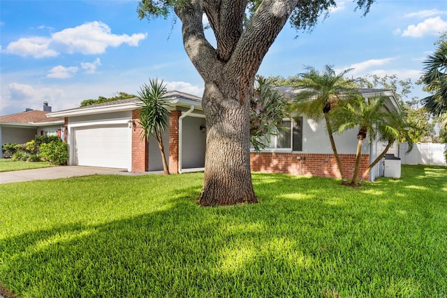 1667 E Orangeside Rd, Palm Harbor, FL 34683 - view of front of house featuring brick siding, a garage, and driveway