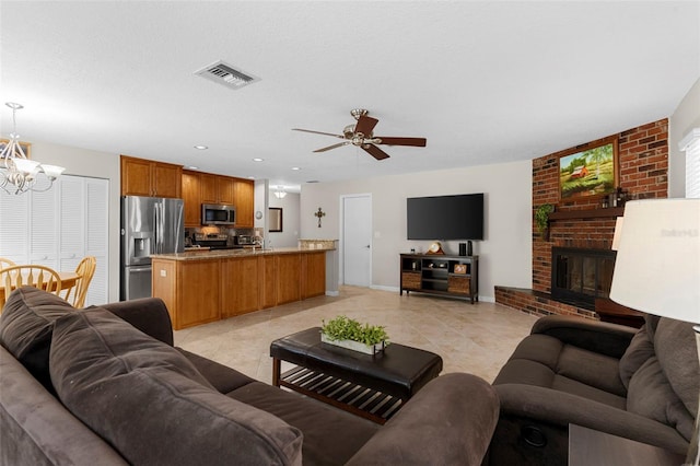 1667 E Orangeside Rd, Palm Harbor, FL 34683 - living area featuring a chandelier, light tile patterned floors, a ceiling fan, and a brick fireplace