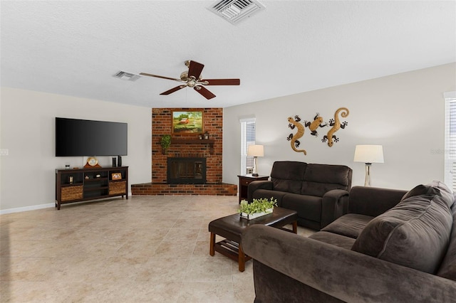 1667 E Orangeside Rd, Palm Harbor, FL 34683 - living area featuring a ceiling fan, healthy amount of natural light, a brick fireplace, and light tile patterned floors