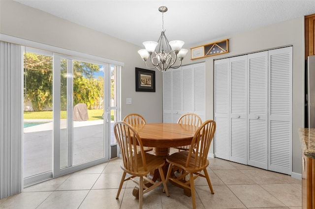 1667 E Orangeside Rd, Palm Harbor, FL 34683 - dining space with a chandelier and light tile patterned floors