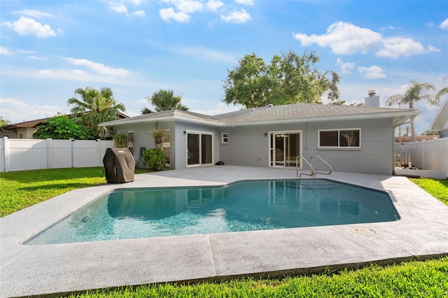 1667 E Orangeside Rd, Palm Harbor, FL 34683 - back of house featuring a patio, a fenced backyard, and a chimney