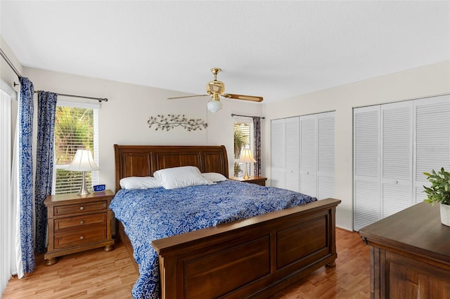 1667 E Orangeside Rd, Palm Harbor, FL 34683 - bedroom featuring light wood-type flooring, multiple closets, and ceiling fan