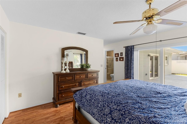 1667 E Orangeside Rd, Palm Harbor, FL 34683 - bedroom featuring light wood finished floors, access to outside, a ceiling fan, and connected bathroom