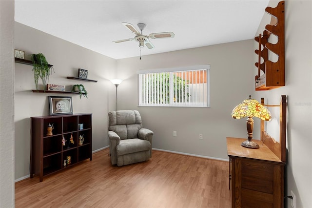 1667 E Orangeside Rd, Palm Harbor, FL 34683 - living area featuring a ceiling fan and light wood-type flooring