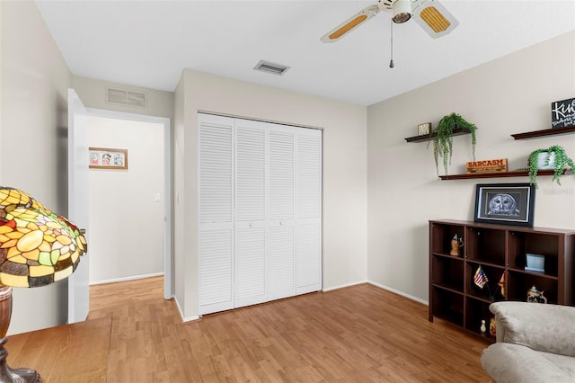 1667 E Orangeside Rd, Palm Harbor, FL 34683 - sitting room with wood finished floors and ceiling fan