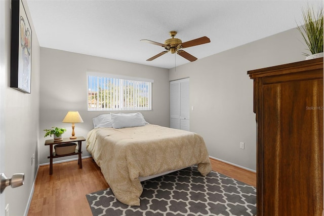 1667 E Orangeside Rd, Palm Harbor, FL 34683 - bedroom with light wood-style flooring, a closet, and a ceiling fan