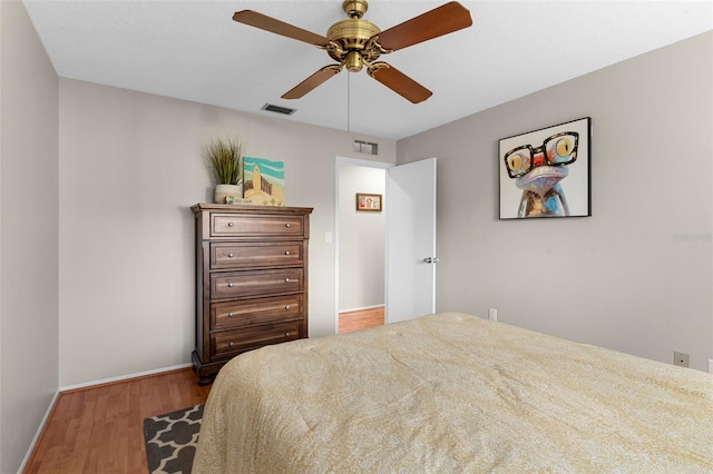 1667 E Orangeside Rd, Palm Harbor, FL 34683 - bedroom featuring wood finished floors and ceiling fan