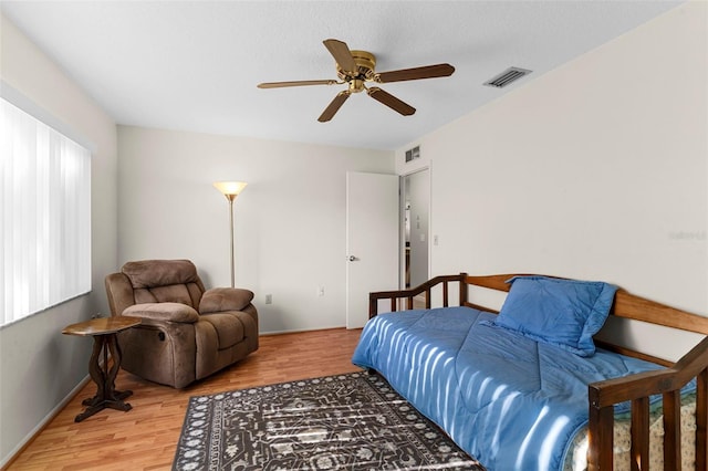 1667 E Orangeside Rd, Palm Harbor, FL 34683 - bedroom featuring wood finished floors and a ceiling fan