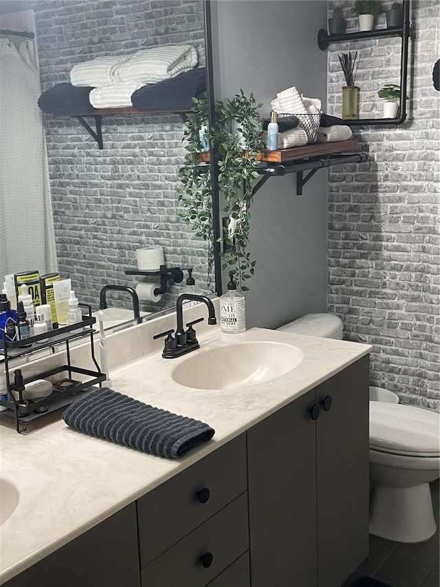 2001 E 2nd Ave Unit 27, Tampa, FL 33605 - bathroom featuring toilet and vanity