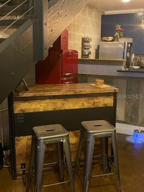 2001 E 2nd Ave Unit 27, Tampa, FL 33605 - bar featuring freestanding refrigerator