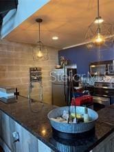 2001 E 2nd Ave Unit 27, Tampa, FL 33605 - bar area with hanging light fixtures