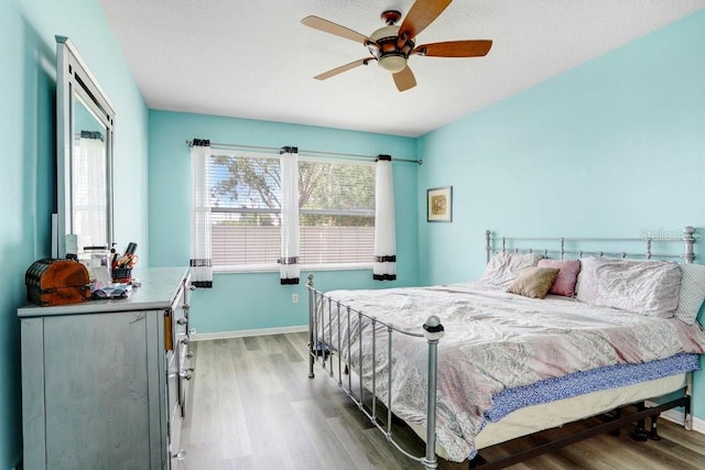 30247 Emmetts Ct, Wesley Chapel, FL 33543 - bedroom featuring wood finished floors and a ceiling fan
