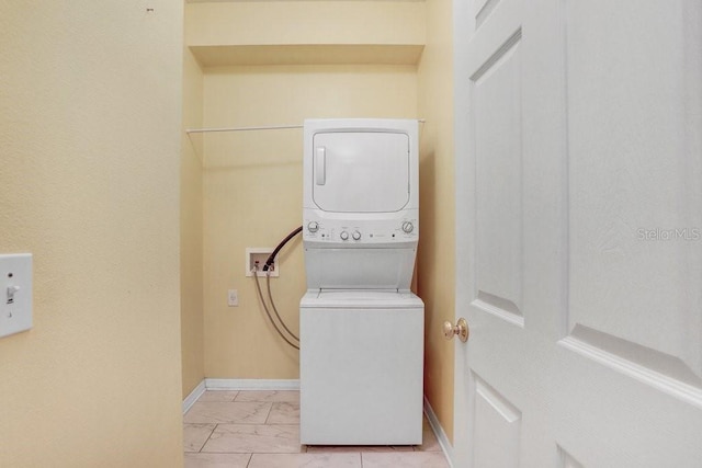 30247 Emmetts Ct, Wesley Chapel, FL 33543 - laundry area with estacked washer and dryer and light marble finish flooring
