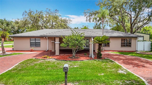 4002 Hudson Ter, Tampa, FL 33618 - ranch-style home featuring stucco siding and decorative driveway