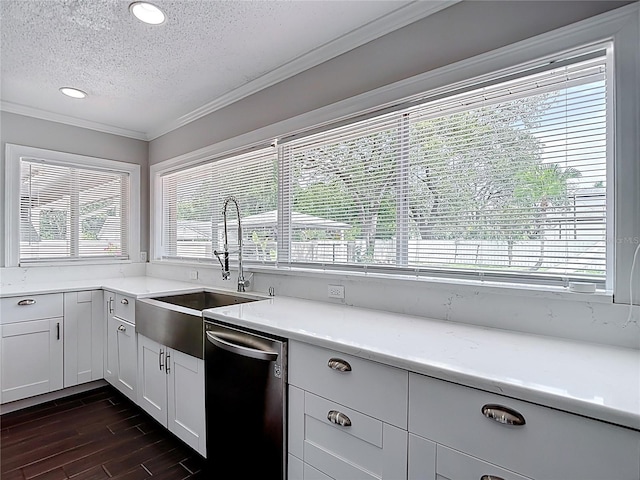 4002 Hudson Ter, Tampa, FL 33618 - kitchen featuring dishwasher, a textured ceiling, ornamental molding, light countertops, and dark wood-style flooring