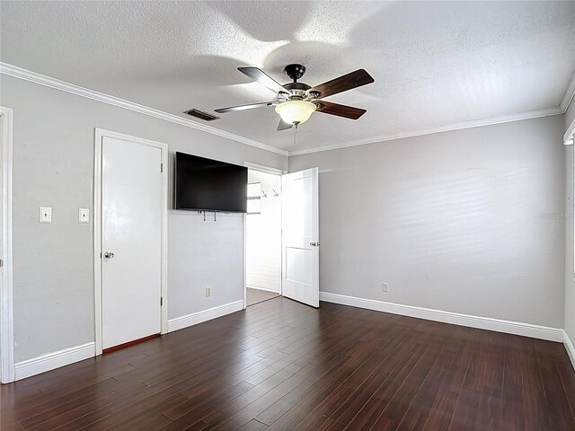 4002 Hudson Ter, Tampa, FL 33618 - unfurnished bedroom featuring dark wood-type flooring, a textured ceiling, ceiling fan, and crown molding