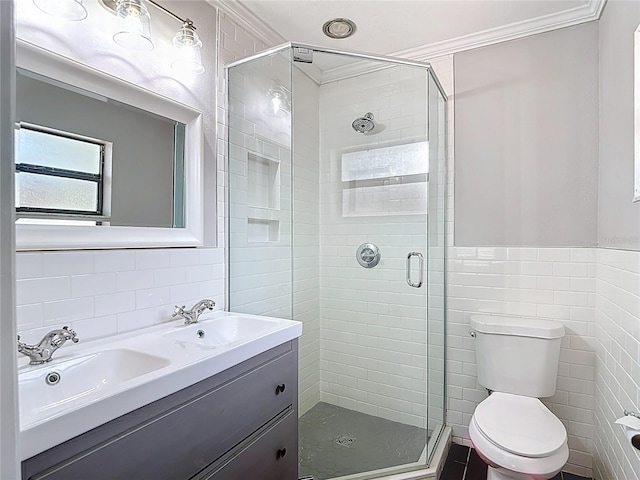 4002 Hudson Ter, Tampa, FL 33618 - bathroom featuring tile walls, crown molding, a stall shower, and double vanity