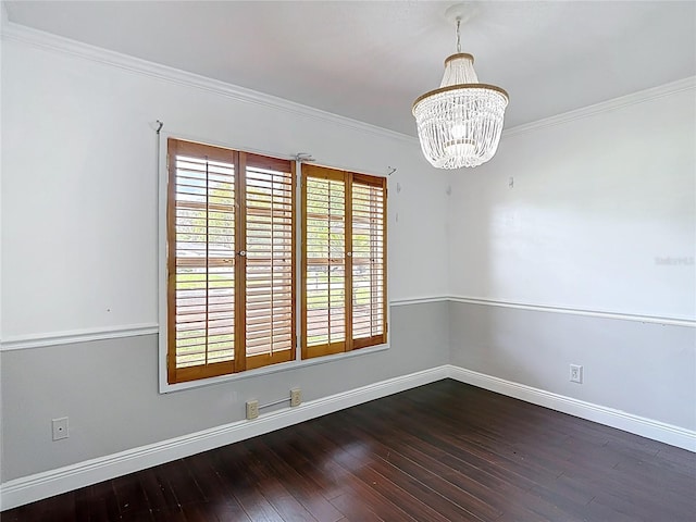 4002 Hudson Ter, Tampa, FL 33618 - empty room featuring a chandelier, dark wood finished floors, and crown molding