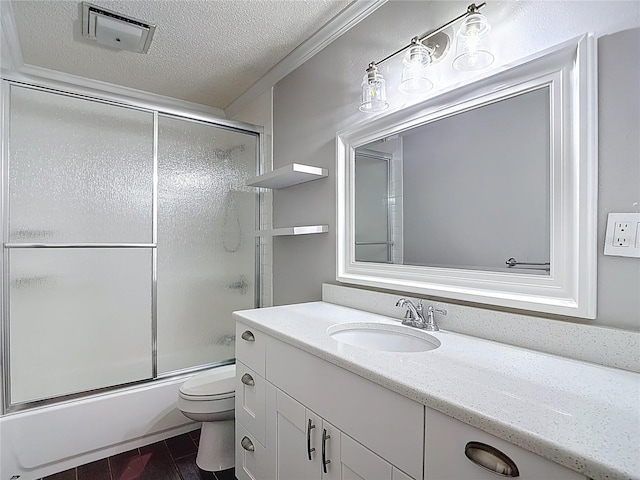 4002 Hudson Ter, Tampa, FL 33618 - bathroom with vanity, a textured ceiling, and combined bath / shower with glass door
