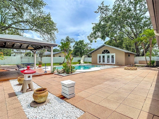 4002 Hudson Ter, Tampa, FL 33618 - fenced backyard with french doors, a patio, and a gazebo