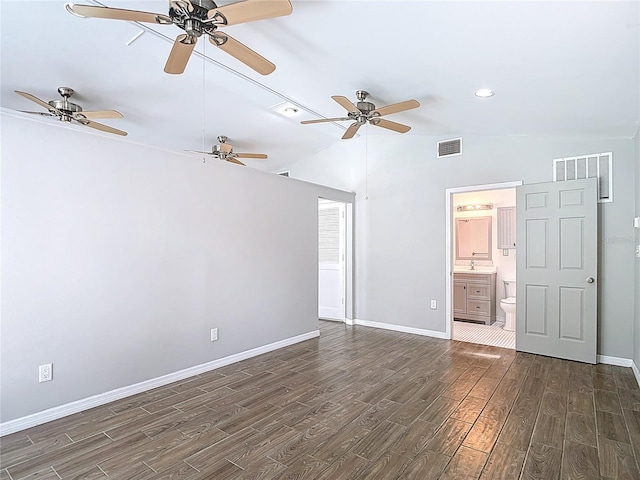 4002 Hudson Ter, Tampa, FL 33618 - unfurnished bedroom with dark wood finished floors, lofted ceiling, ensuite bath, ceiling fan, and recessed lighting