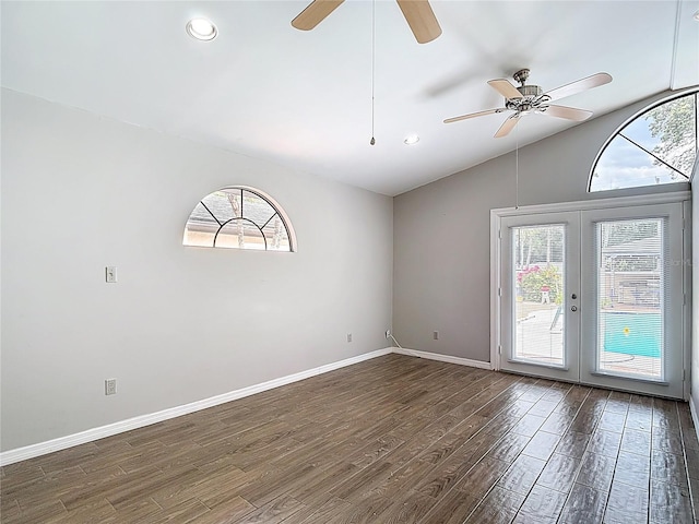 4002 Hudson Ter, Tampa, FL 33618 - empty room featuring plenty of natural light, wood finished floors, ceiling fan, french doors, and vaulted ceiling