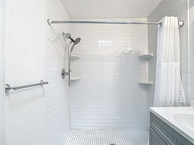4002 Hudson Ter, Tampa, FL 33618 - bathroom featuring a tile shower and vanity