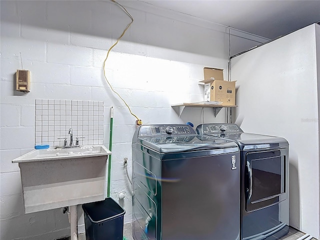 4002 Hudson Ter, Tampa, FL 33618 - washroom with washing machine and dryer and concrete block wall
