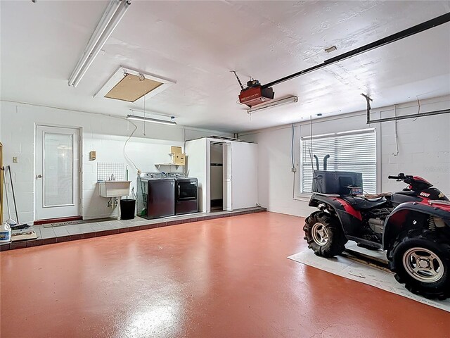 4002 Hudson Ter, Tampa, FL 33618 - garage featuring a garage door opener and independent washer and dryer