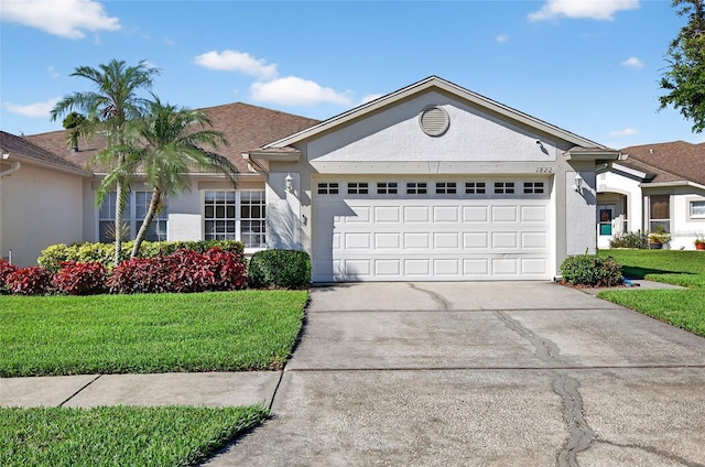 1822 Sassafras Dr, Wesley Chapel, FL 33543 - single story home with an attached garage, stucco siding, a front lawn, and driveway