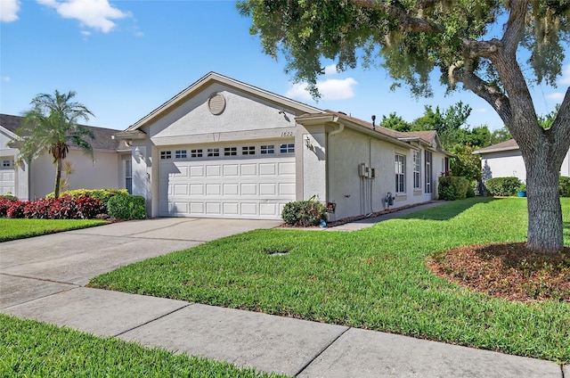 1822 Sassafras Dr, Wesley Chapel, FL 33543 - view of front of property with a garage, stucco siding, concrete driveway, and a front lawn