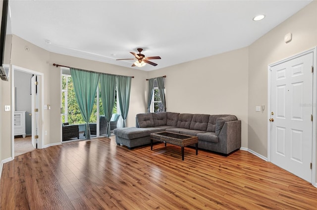 1822 Sassafras Dr, Wesley Chapel, FL 33543 - living area with light wood-style flooring, healthy amount of natural light, ceiling fan, and recessed lighting