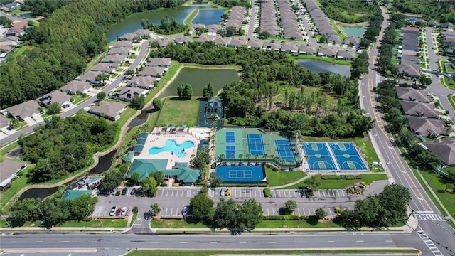 1822 Sassafras Dr, Wesley Chapel, FL 33543 - aerial view of property and surrounding area with a large body of water and nearby suburban area