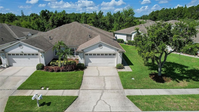 1822 Sassafras Dr, Wesley Chapel, FL 33543 - ranch-style home with driveway, an attached garage, and a front yard