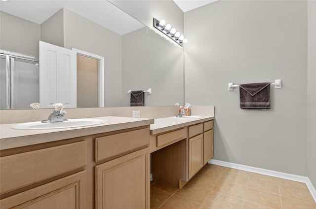 1822 Sassafras Dr, Wesley Chapel, FL 33543 - full bathroom featuring double vanity, tile patterned floors, and an enclosed shower
