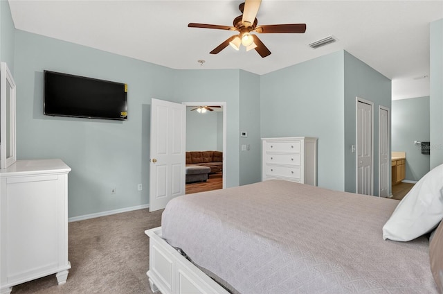 1822 Sassafras Dr, Wesley Chapel, FL 33543 - bedroom featuring carpet, connected bathroom, and a ceiling fan