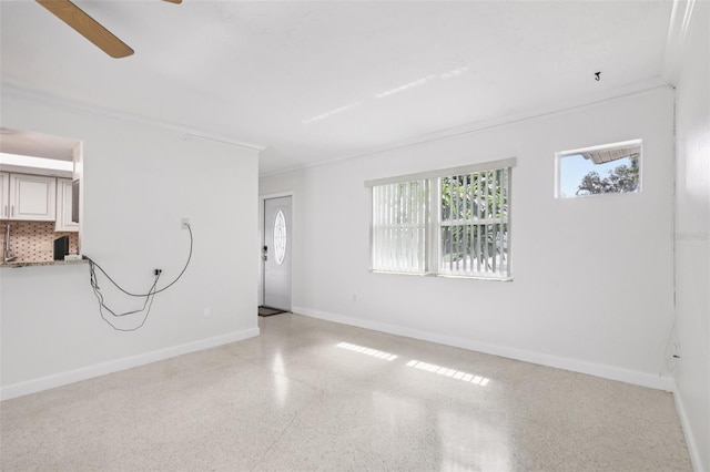 6220 Murdock Ave, Sarasota, FL 34231 - empty room with speckled floor and ceiling fan