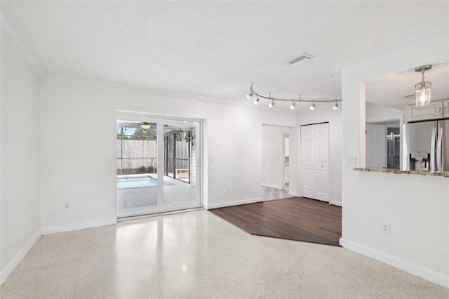 6220 Murdock Ave, Sarasota, FL 34231 - unfurnished room with ornamental molding, a ceiling fan, and speckle patterned floor