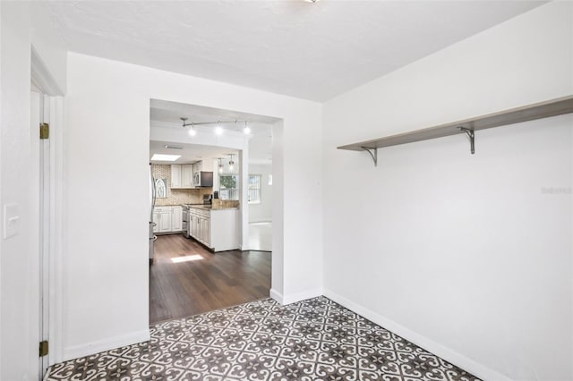 6220 Murdock Ave, Sarasota, FL 34231 - hall with rail lighting and baseboards