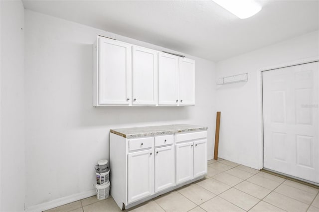 6220 Murdock Ave, Sarasota, FL 34231 - laundry area featuring light tile patterned floors and baseboards
