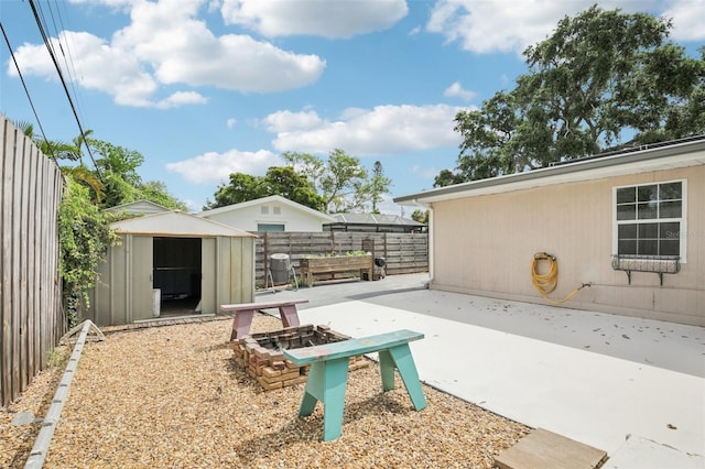 6220 Murdock Ave, Sarasota, FL 34231 - fenced backyard with a patio area and a storage unit