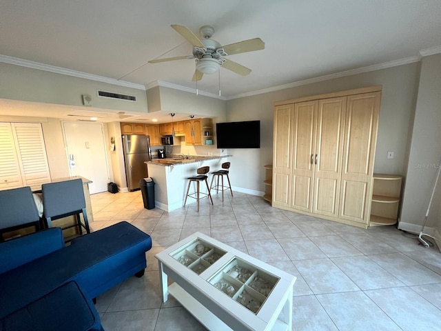 880 Mandalay Ave Unit C412, Clearwater Beach, FL 33767 - living area with crown molding, ceiling fan, and light tile patterned floors