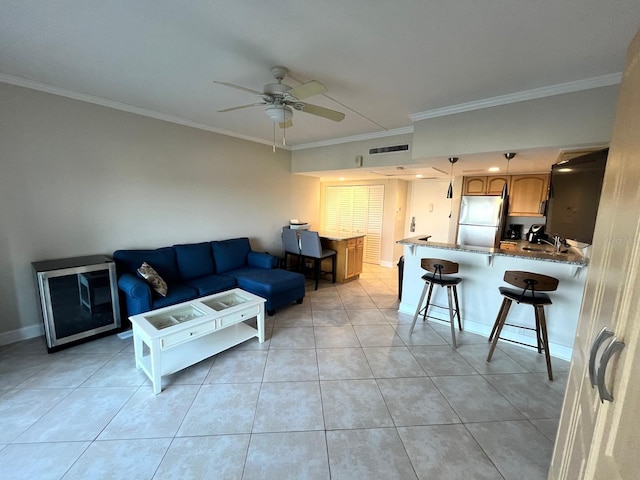 880 Mandalay Ave Unit C412, Clearwater Beach, FL 33767 - living area with ornamental molding, a ceiling fan, and light tile patterned floors