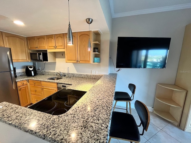 880 Mandalay Ave Unit C412, Clearwater Beach, FL 33767 - kitchen featuring black microwave, range, crown molding, a peninsula, and freestanding refrigerator