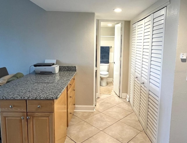 880 Mandalay Ave Unit C412, Clearwater Beach, FL 33767 - bathroom featuring a closet, tile patterned floors, and vanity