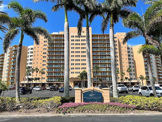 880 Mandalay Ave Unit C412, Clearwater Beach, FL 33767 - view of apartment building / complex with uncovered parking