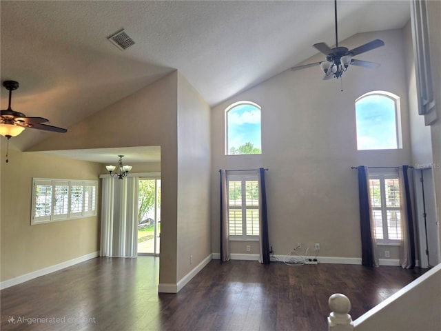 31141 Harthorn Ct, Wesley Chapel, FL 33543 - unfurnished living room with ceiling fan, high vaulted ceiling, wood finished floors, and a chandelier