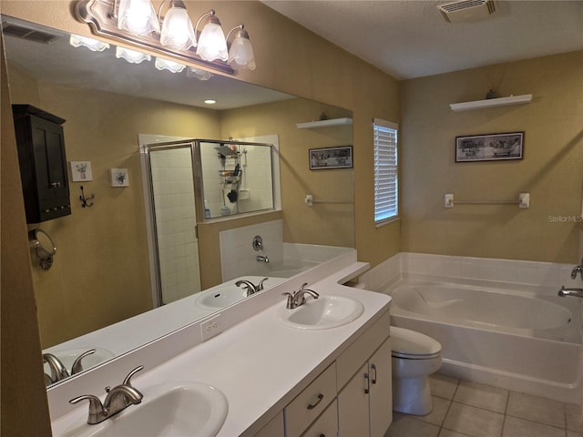 31141 Harthorn Ct, Wesley Chapel, FL 33543 - full bath with a garden tub, a shower stall, tile patterned flooring, and double vanity